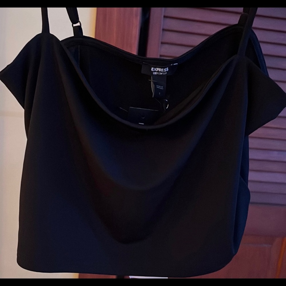 Black adjustable straps. New with tags
